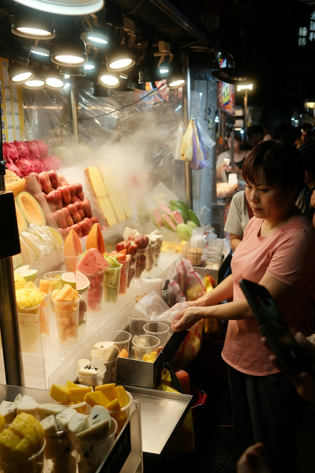market vendor selling fruits