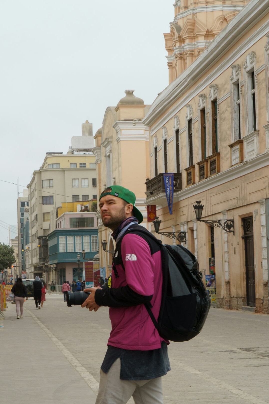 photographer walking city street